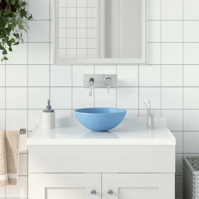 Imagen del producto de El lavabo de cerámica azul claro, modelo "Living Store", de forma redonda