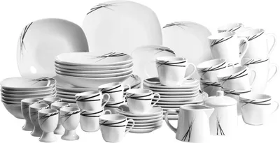 A collection of white porcelain dinnerware with black line accents, arranged on a white background.