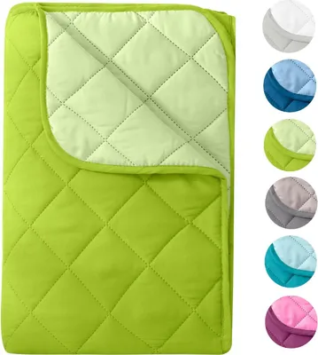 A folded green quilted blanket shown from above, with a lighter green inner lining visible.
