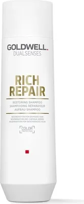 A white bottle of Goldwell Dualsenses Rich Repair shampoo against a white background.