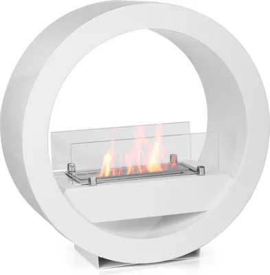 A white, circular ethanol fireplace with a glass wind guard and visible flames.