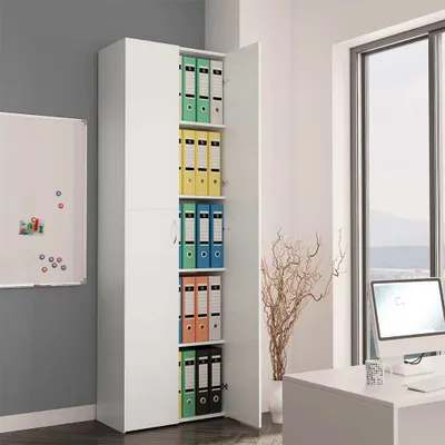 An office or study with a tall white cabinet filled with binders, a whiteboard, and a desk with a computer.