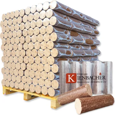 A large stack of firewood briquettes on a wooden pallet, with some briquettes in the foreground.