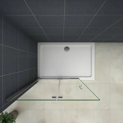 A top-down view of a shower enclosure with a white shower tray and clear glass doors.