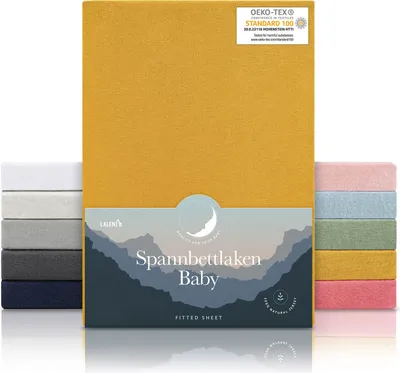 A product image featuring a yellow fitted sheet packaging with stacks of fitted sheets in various colors on either side.