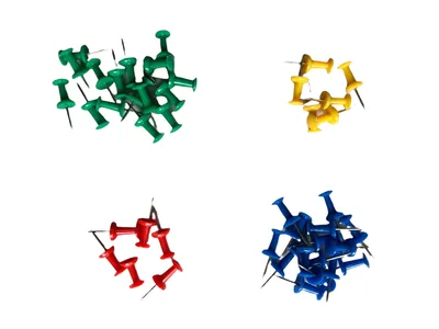 Four piles of colorful push pins are arranged in a grid on a white background.