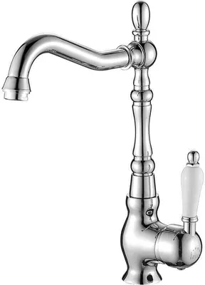 A chrome-finished kitchen faucet with a white handle, shown against a white background.