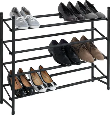 A three-tier black metal shoe rack filled with various shoes.