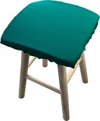A teal stool cushion on a wooden stool.