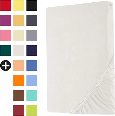 A white fitted sheet is shown on a white background, with a swatch of colors to the left.
