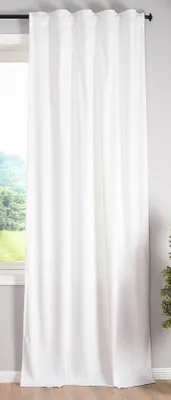 A white curtain hanging in front of a window.