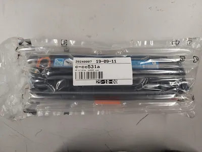A product in its original packaging, likely a toner cartridge, is shown against a light gray background.