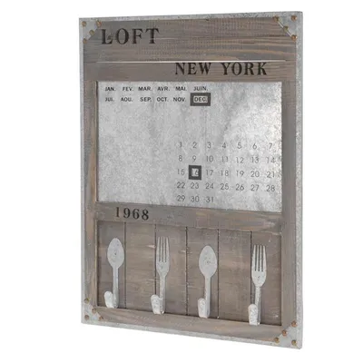 A decorative memo board with a calendar and hooks.