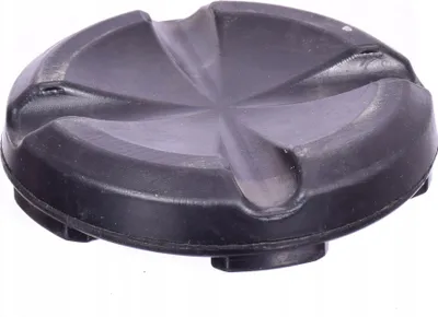 A black rubber jack pad with a star-shaped indentation on top, shown from a slightly elevated angle.