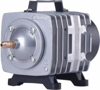 A silver air pump with a black base and handle, featuring a bronze nozzle.
