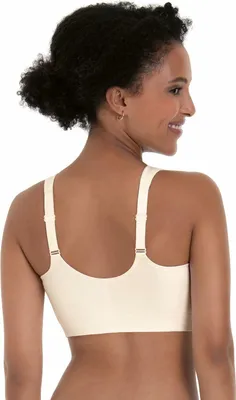 A woman is shown from the back wearing a beige bra.