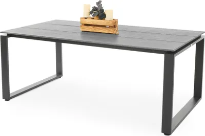 A rectangular outdoor dining table with a gray tabletop and black metal legs, set against a white background. A small wooden crate with decorative items is placed on the tabletop.