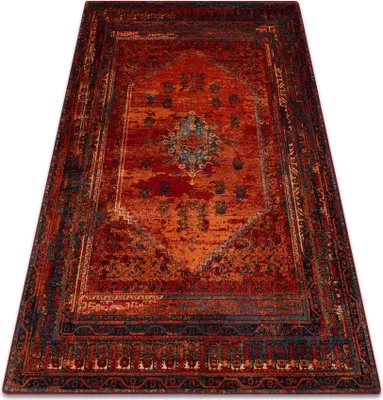 A Persian-style rug with a distressed, vintage look, featuring a central medallion and intricate border patterns in shades of red, orange, and blue.