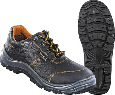 A black safety shoe with orange accents and yellow laces is shown next to its sole.