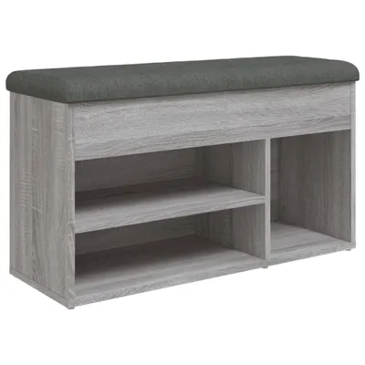 A shoe bench with storage compartments and a padded top.