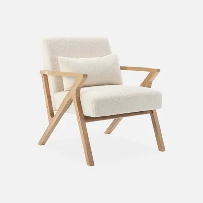 A cream-colored armchair with a wooden frame is shown against a light gray background.