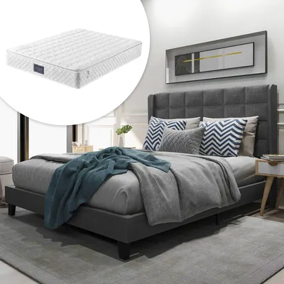 A bedroom scene featuring a bed with a mattress, pillows, and blankets, with a separate inset image of the mattress.