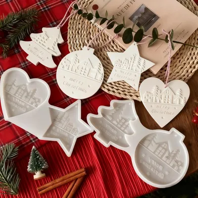 Image de Moules en silicone pour réaliser soi-même des décorations de Noël, comme par exemple un poinsettia, un cœur ou une boule de Noël.