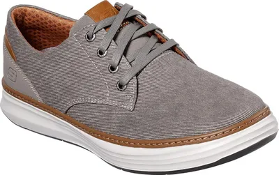 A single gray sneaker with brown accents is shown against a white background.