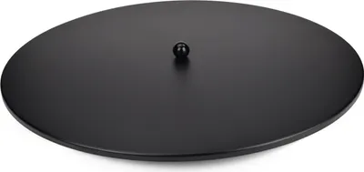 A black, round metal plate with a small black ball in the center, placed on a white background.