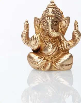 A golden statue of Ganesha is shown against a white background.