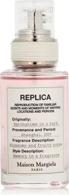 A bottle of Maison Margiela Replica perfume.