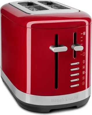 A red KitchenAid toaster is shown in a studio setting against a white background.