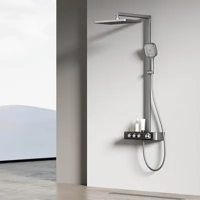 A modern bathroom shower system mounted on a light gray wall, with a minimalist background.