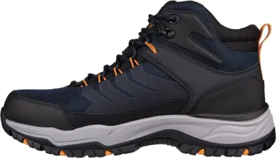 A side view of a single hiking boot against a white background.