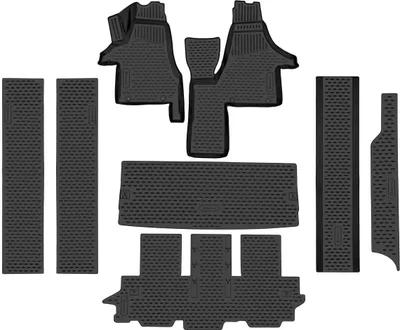 A set of black rubber floor mats for a car, laid out on a white background.