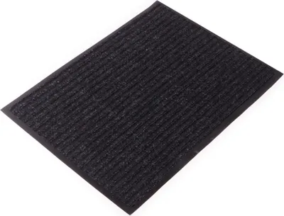 A dark gray ribbed doormat on a white background.