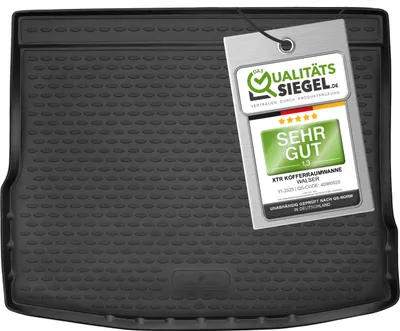A black car trunk liner with a quality seal tag attached.