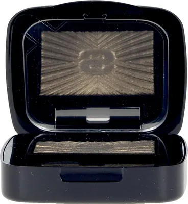 An open compact of eyeshadow with a metallic khaki shade.