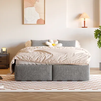 A bedroom scene with a bed, nightstand, and artwork.