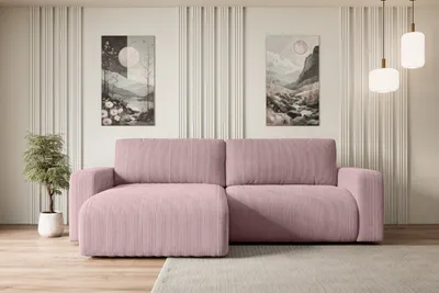 A pink corduroy sectional sofa is shown in a well-lit room with minimalist decor.