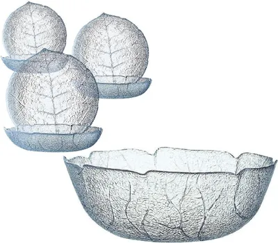 A set of glass bowls and plates with a leaf design, arranged on a white background.