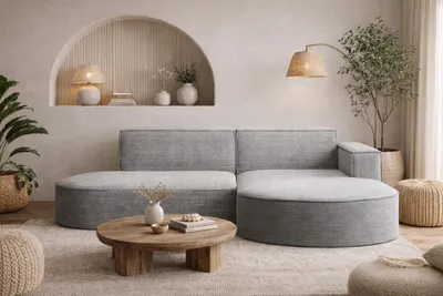 A modern living room scene featuring a sectional sofa, coffee table, and floor lamp.