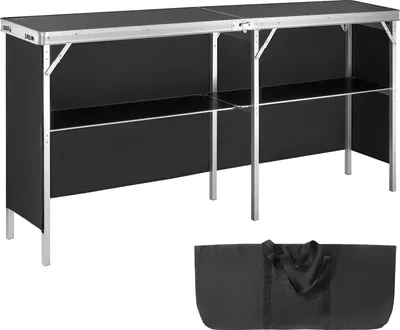 A black and silver portable trade show counter with a storage shelf and a black carrying bag shown below it, set against a white background.