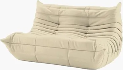 A beige two-seater sofa with a tufted design.