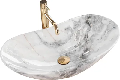 A close-up studio shot of a marble-patterned vessel sink with a gold faucet.