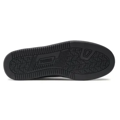 The sole of a black Puma sneaker is shown against a white background.