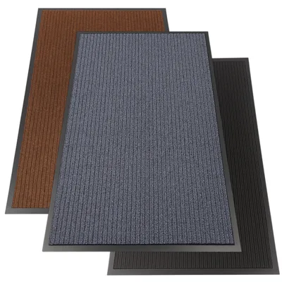 Three doormats of different colors are stacked on top of each other.