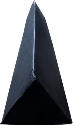 A close-up, slightly angled view of a sharp, dark pyramid-like object, possibly a tool or decorative item, against a plain white background.
