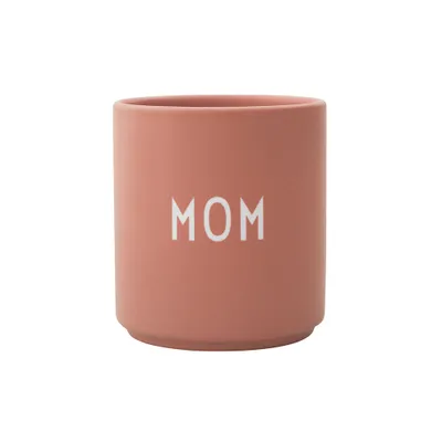 A coral-colored cup with the word "MOM" printed in white on the front, isolated on a white background.