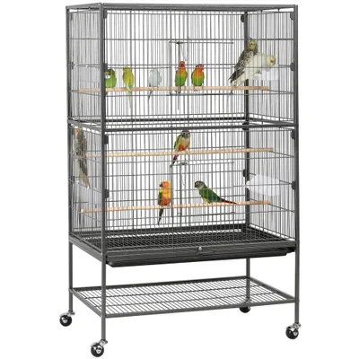 A multi-level bird cage with several birds inside, displayed on a white background.